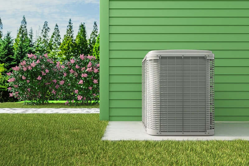 air conditioner placed on the outside of a home.